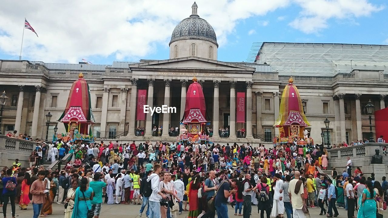 TOURISTS IN FRONT OF TEMPLE