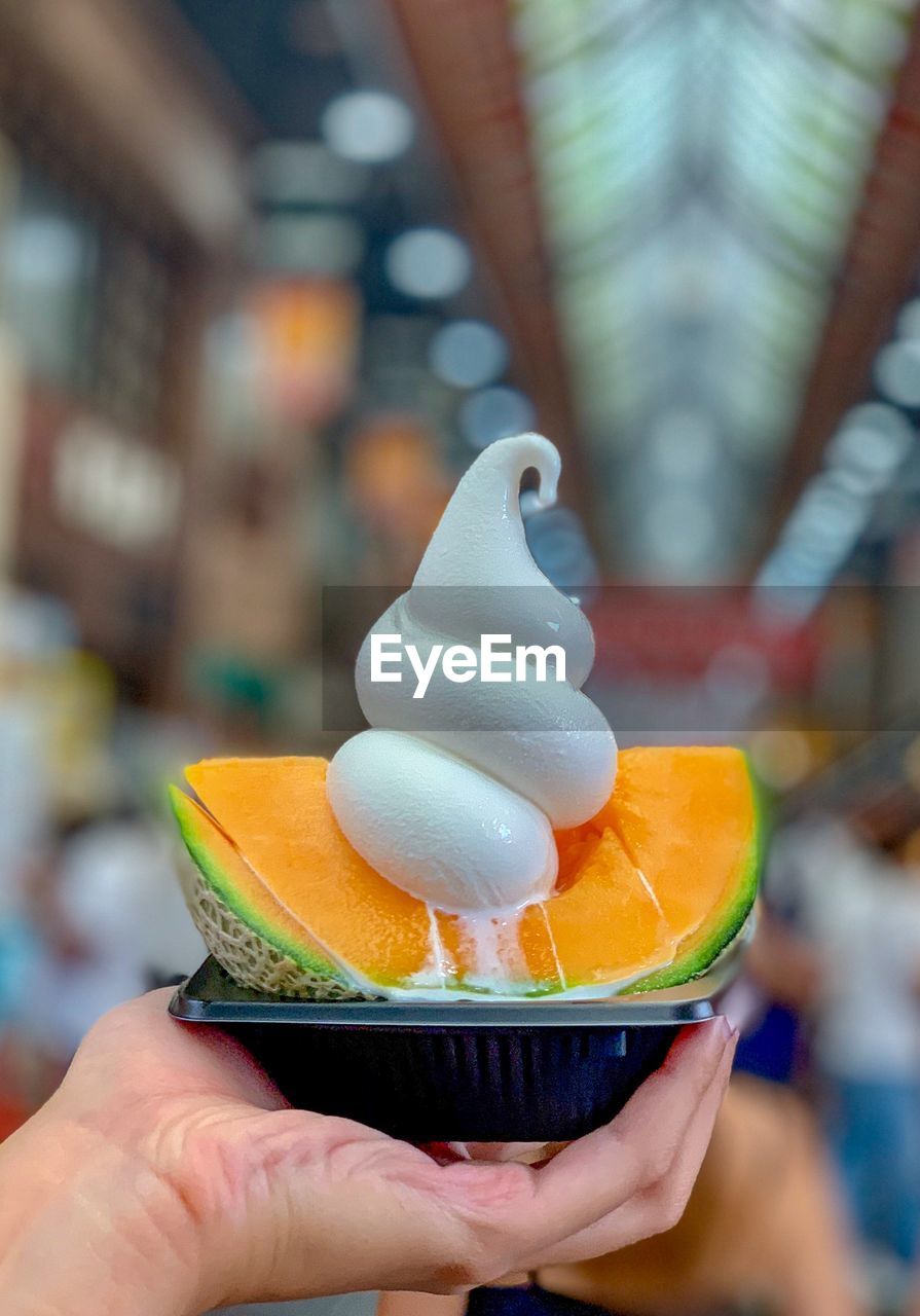 Close-up of person holding ice cream cone