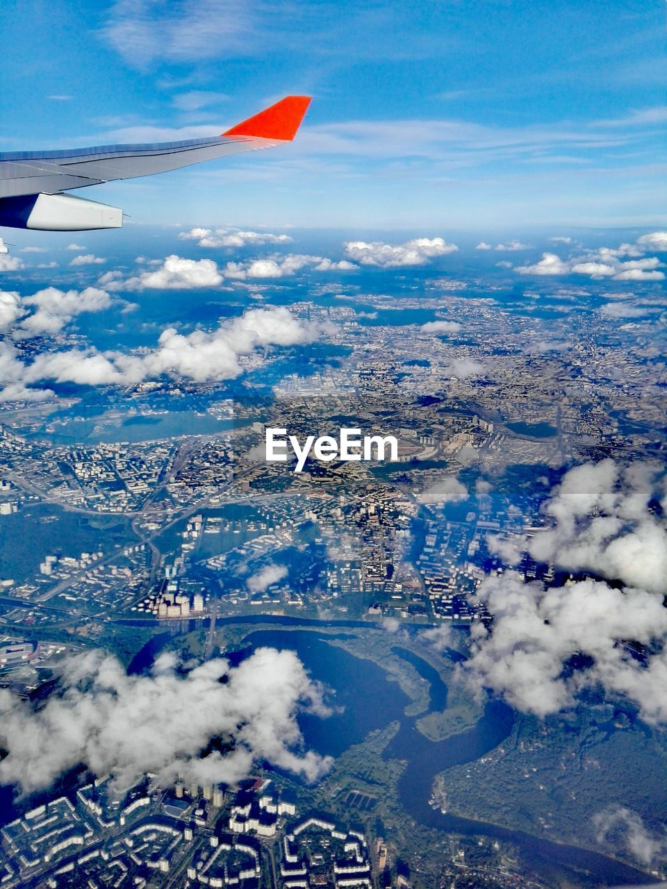 AERIAL VIEW OF AIRPLANE WING OVER LANDSCAPE