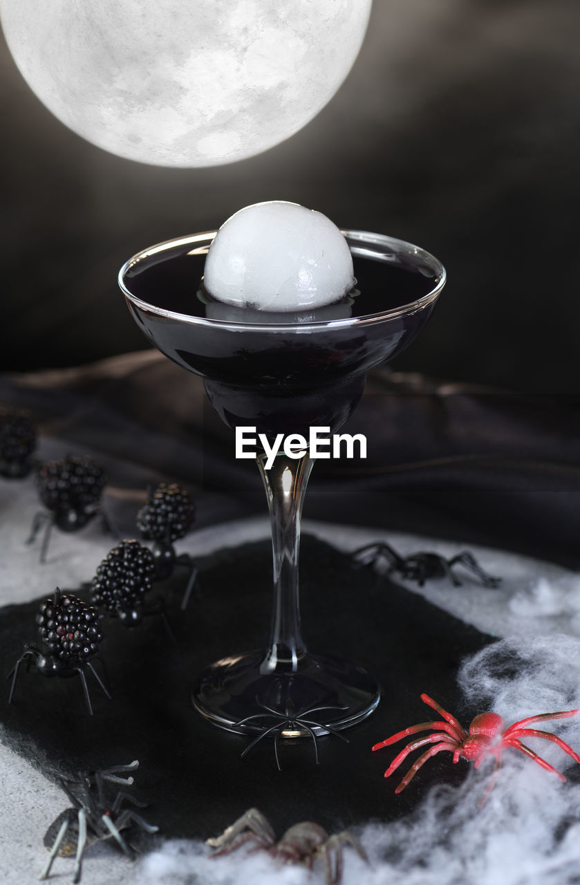 Blueberry martini is a full moon tini in a glass. halloween cocktail idea