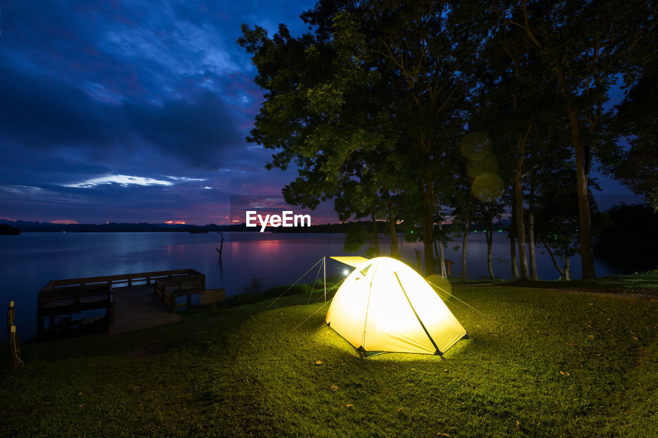 Scenic view of field against sky at night