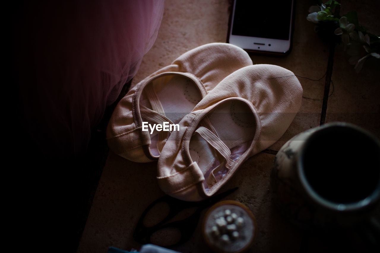 Ballet shoes sitting on table