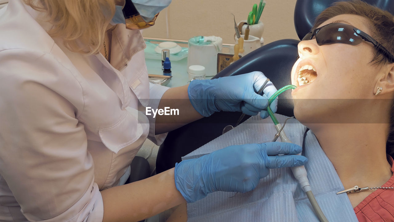 Dentist examining patient