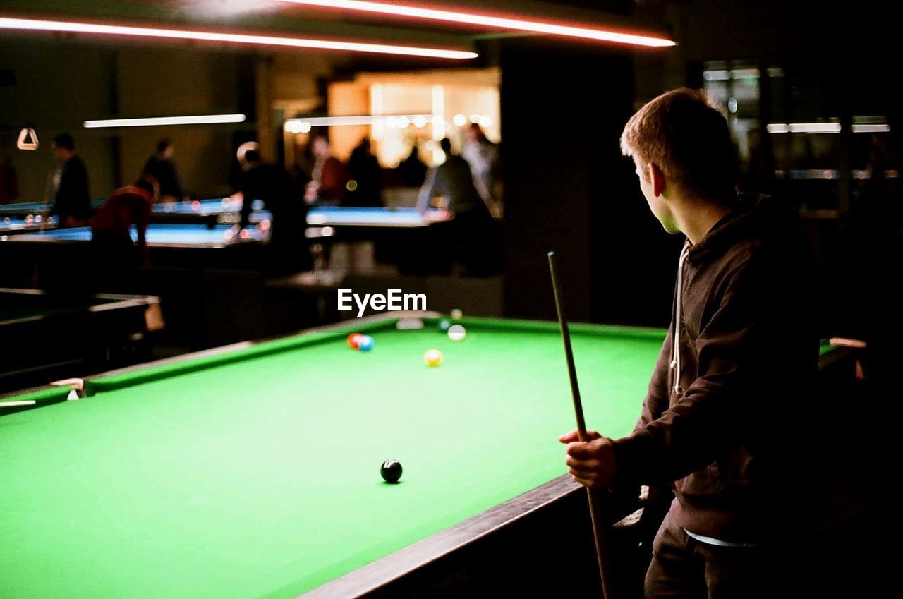 Man playing snooker