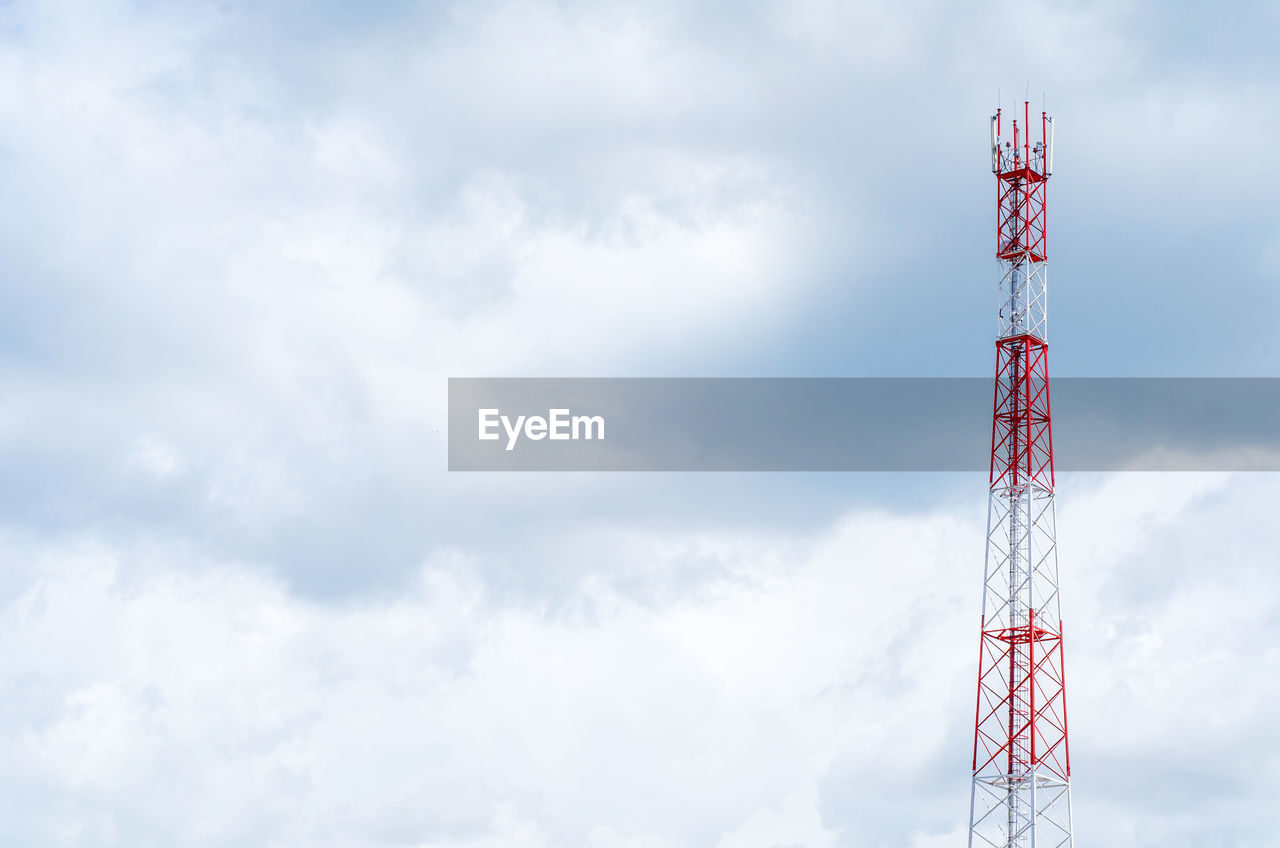 Low angle view of communications tower against sky