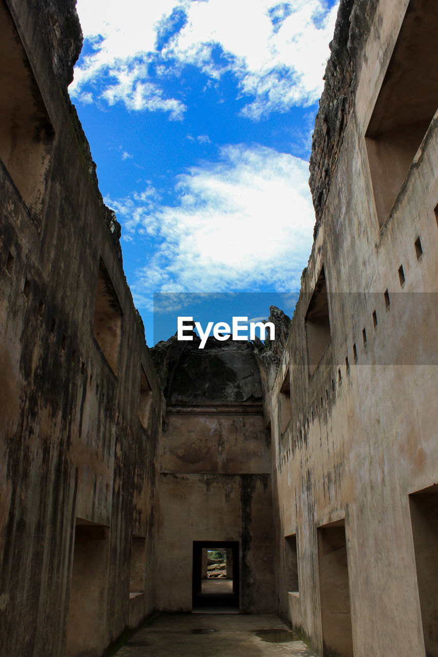 Low angle view of old buildings against sky