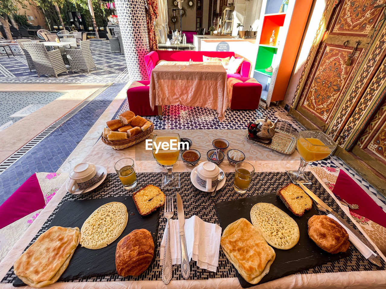 food and drink, food, table, bread, snack, freshness, no people, fast food, meal, baked, high angle view, healthy eating, day, drink, bakery, seat, chair, wellbeing, business, sweet food, plate, brunch, breakfast, outdoors, dessert, variation, still life