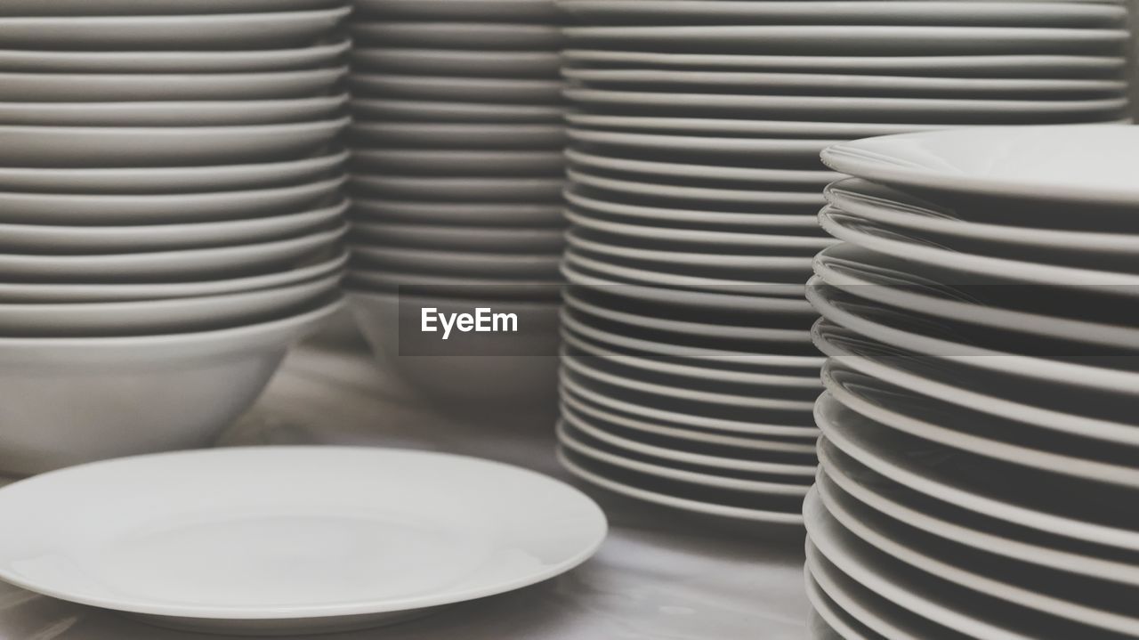 Stack of bowls and plates on table
