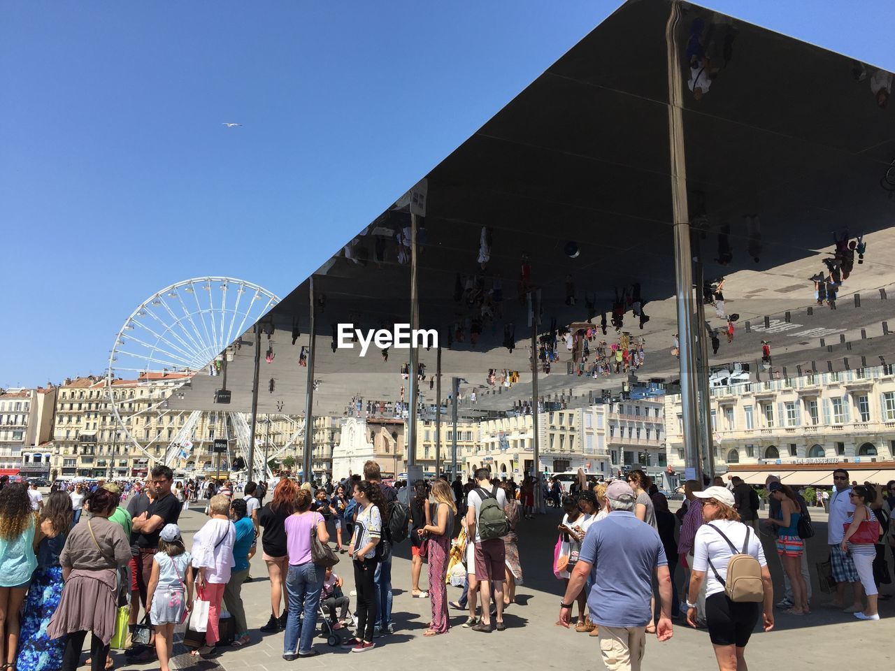 PEOPLE IN CITY AGAINST SKY
