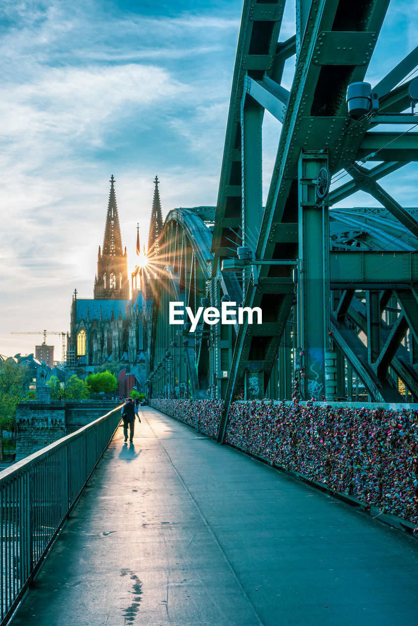 View from the hohenzollern bridge to cologne cathedral at sunset, germany.
