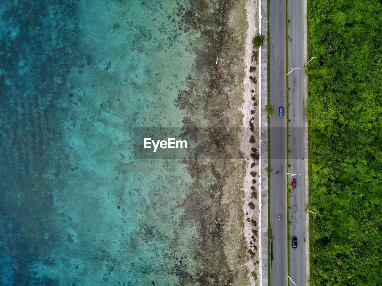 High angle view of highway by emerald beach in cozumel island.