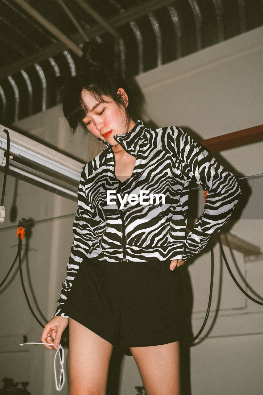 Portrait of thai girl with double bun wearing zebra print top