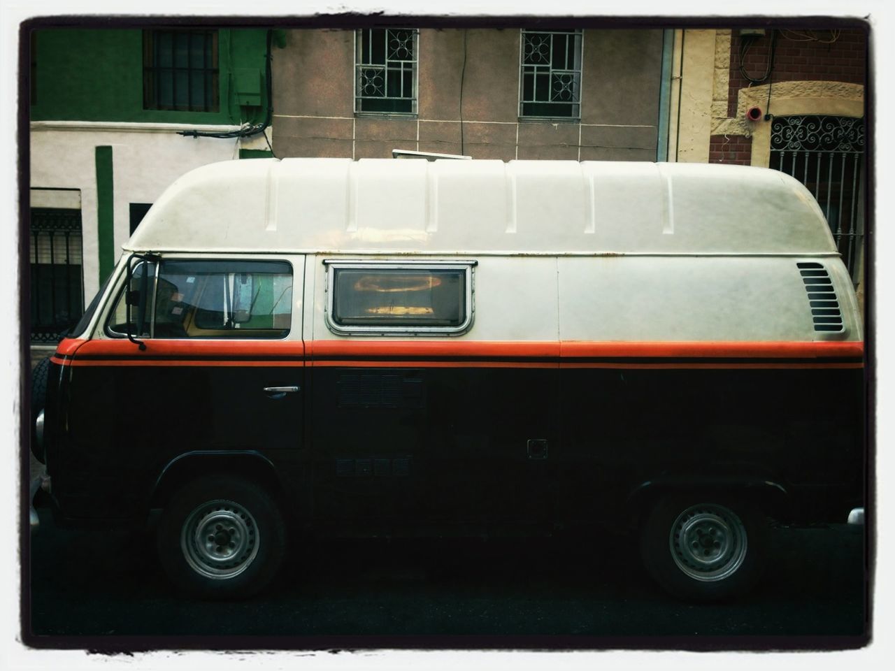 VINTAGE CAR PARKED ON STREET