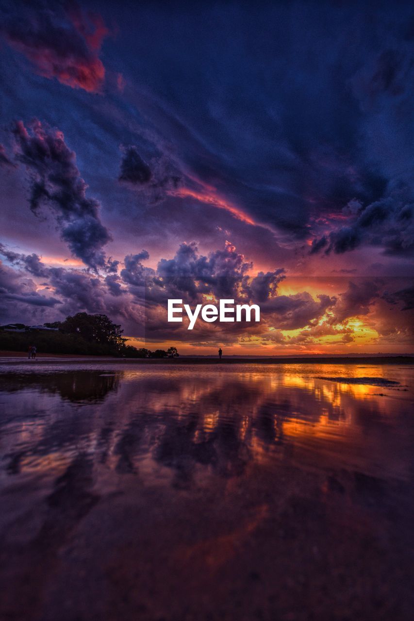 SCENIC VIEW OF LAKE AGAINST ROMANTIC SKY