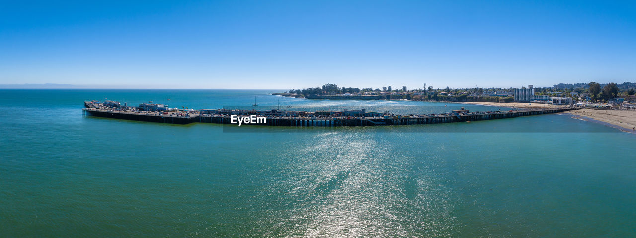 high angle view of boats in sea against clear blue sky