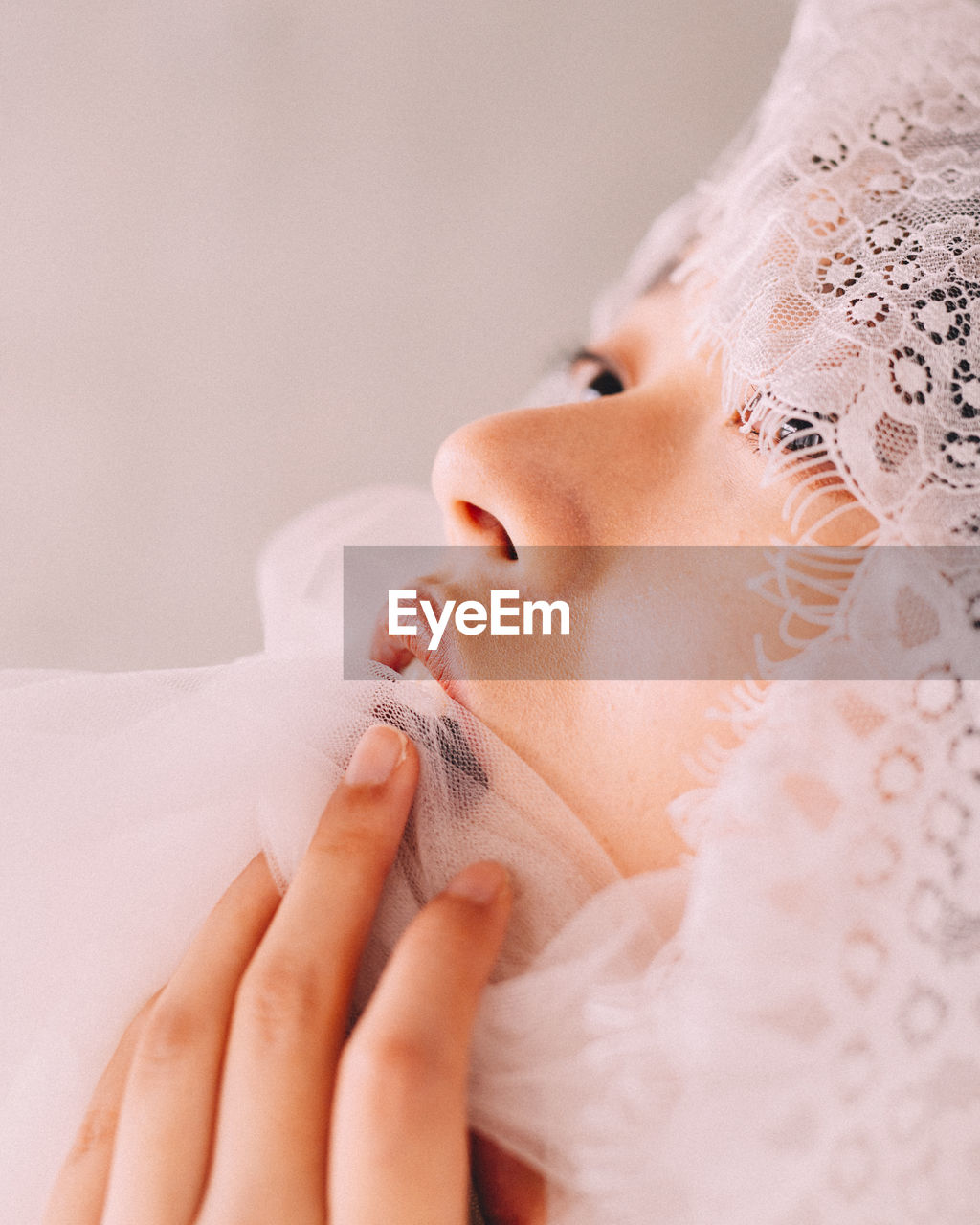 Close-up of young woman wearing veil