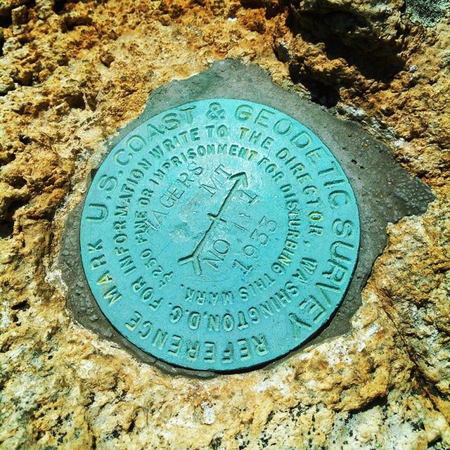 CLOSE-UP OF CLOCK ON WALL