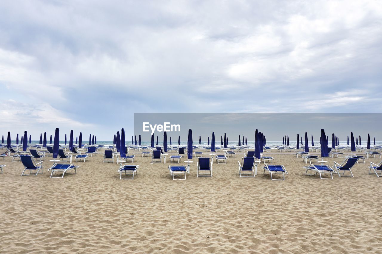 Sunshades and lounge chairs on beach