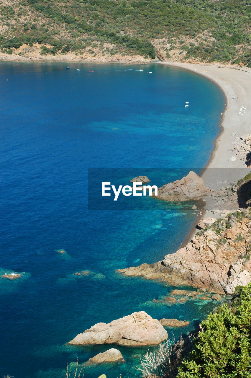 High angle view of sea and rocks