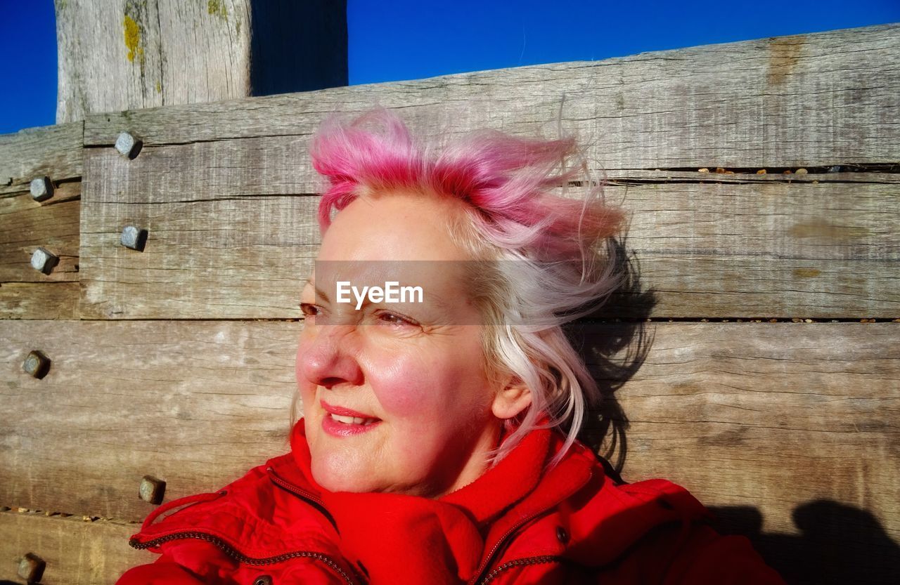 Close-up smiling mature woman looking away