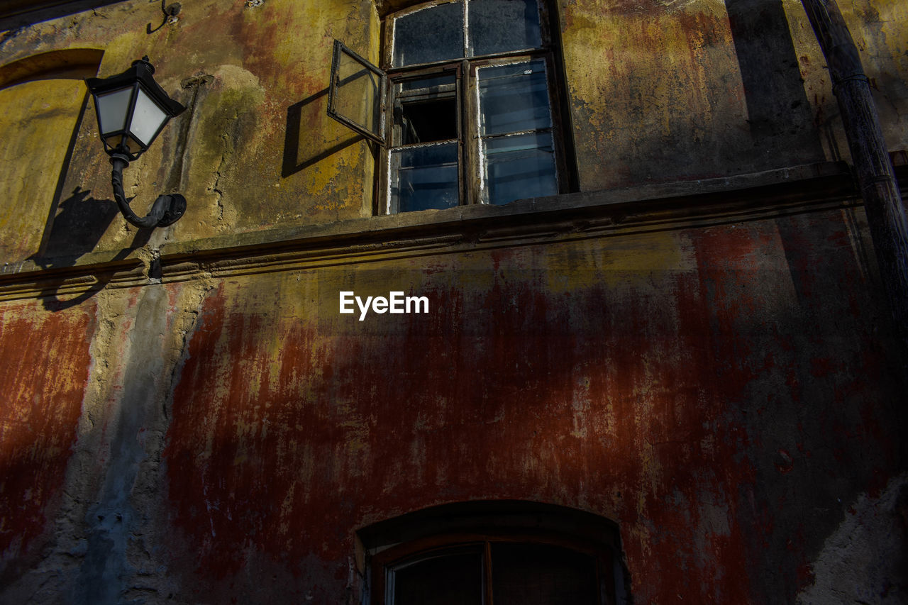 Low angle view of house window on building