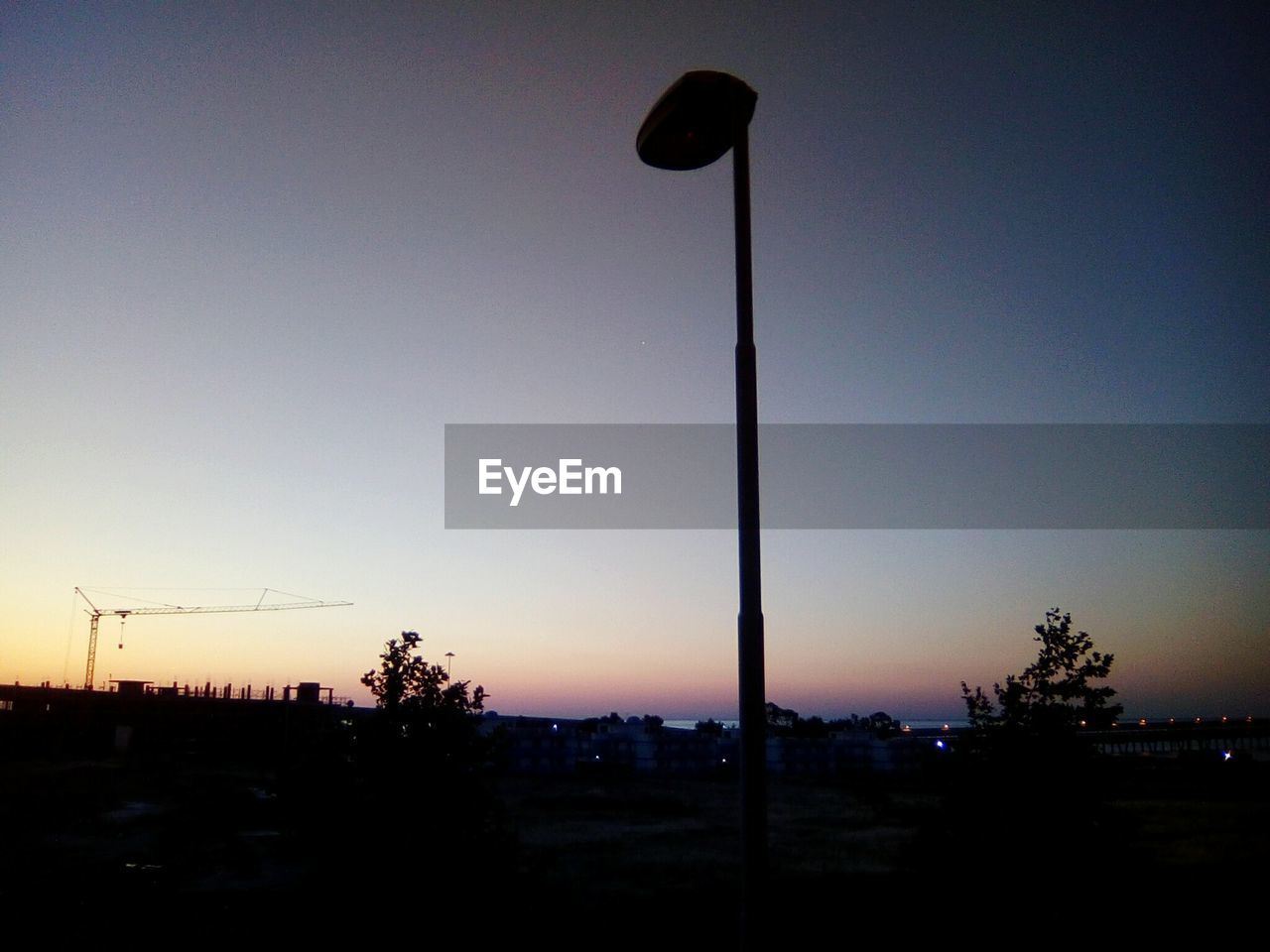 SILHOUETTE STREET LIGHT AGAINST CLEAR SKY