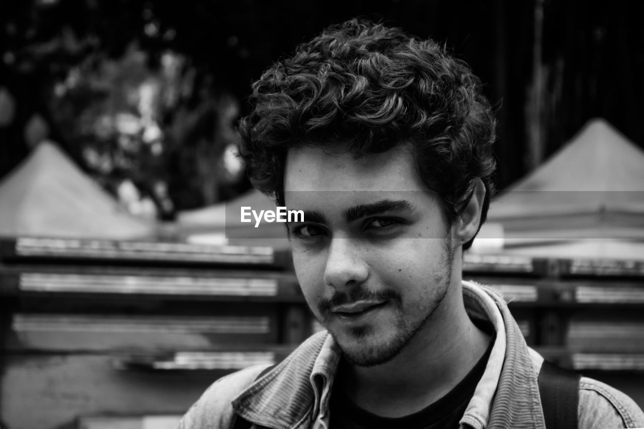 Portrait of smiling young man outdoors