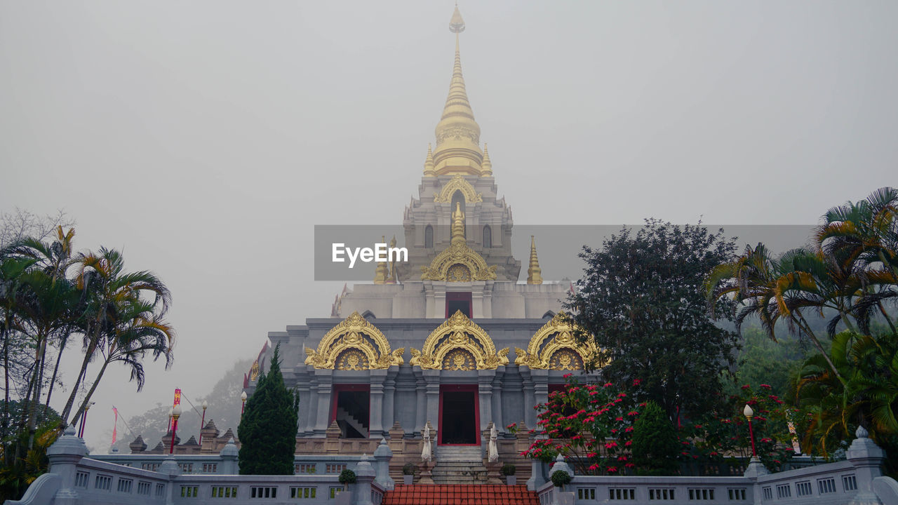 TEMPLE AGAINST BUILDING