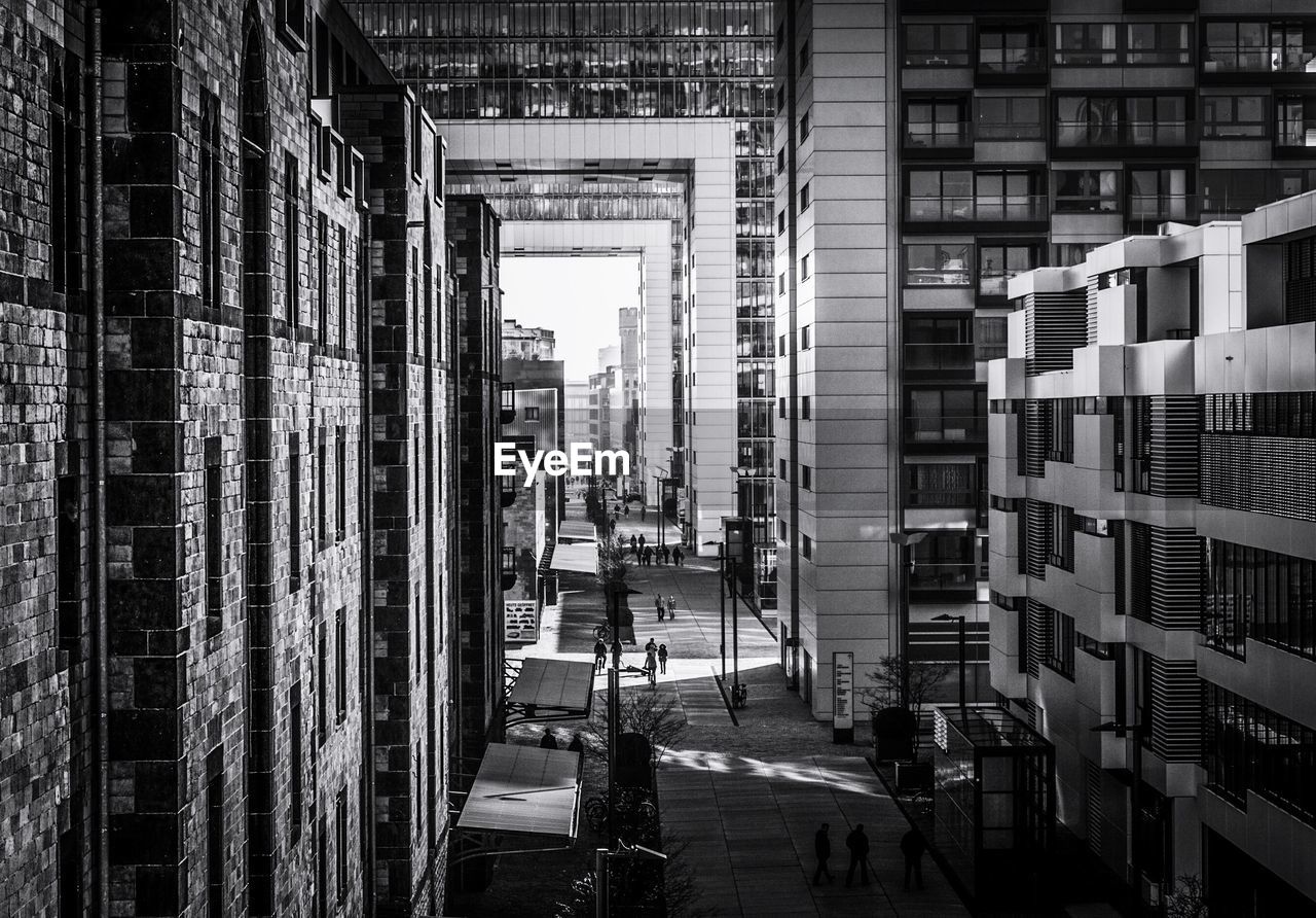 High angle view of footpath amidst buildings