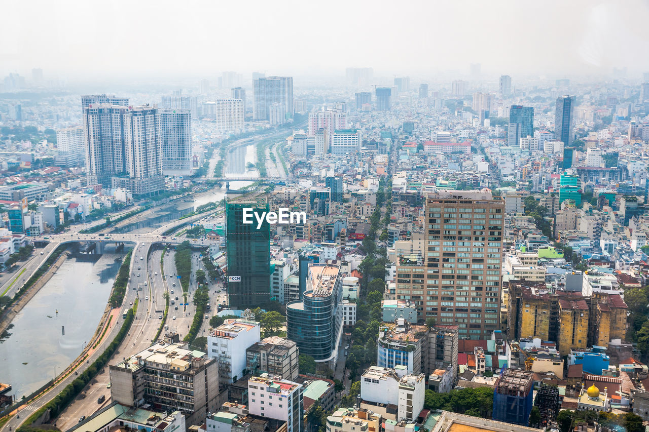High angle view of city buildings against sky