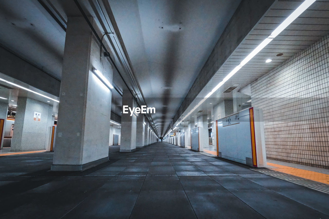 A dim passageway in a subway station