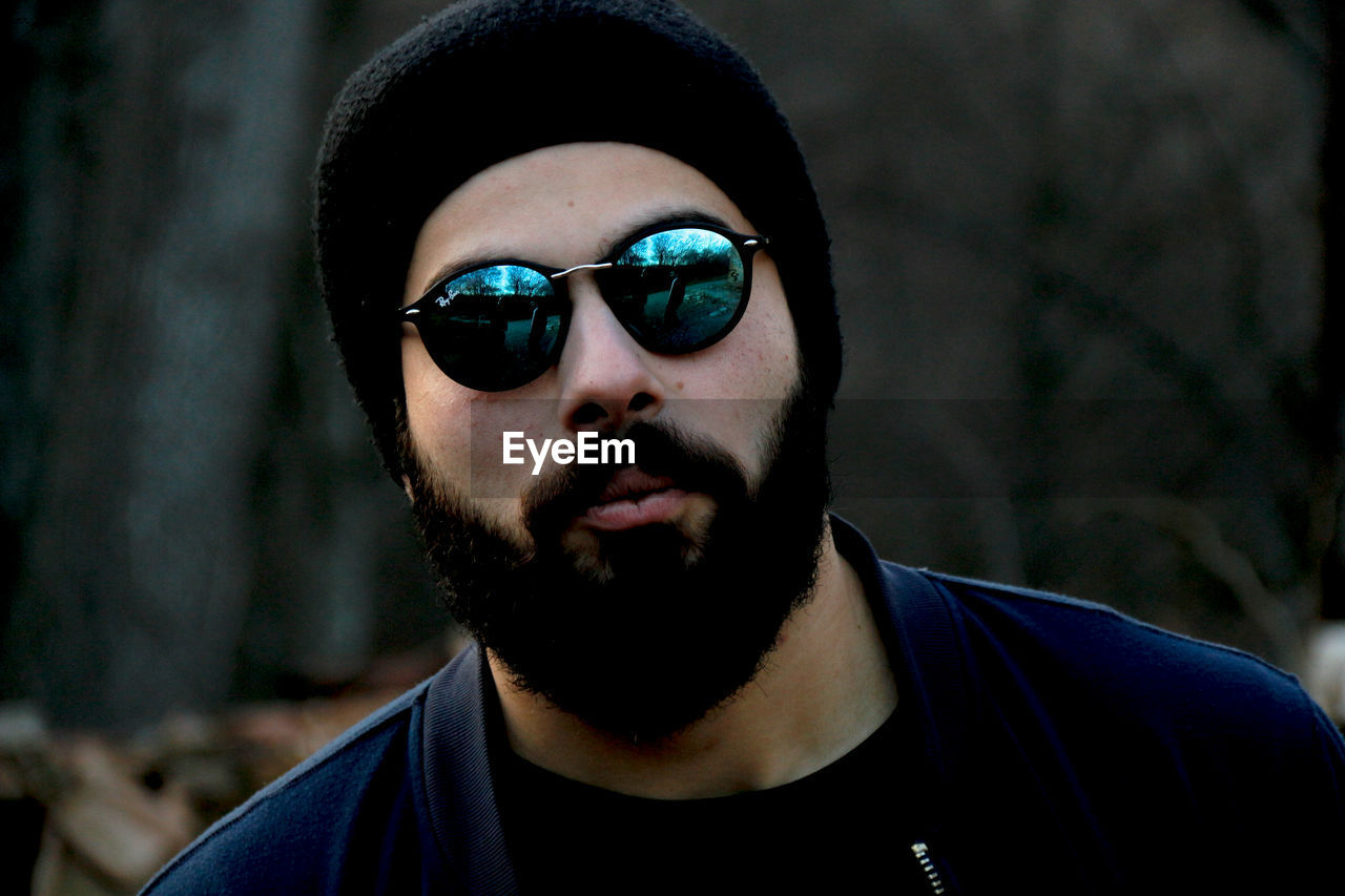 Close-up portrait of bearded man wearing sunglasses