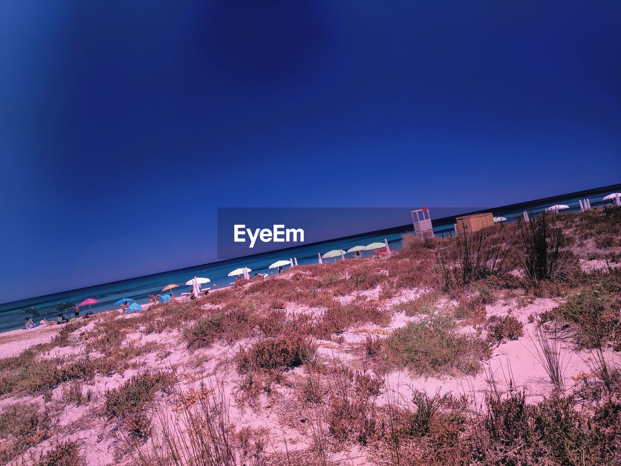 BRIDGE OVER SEA AGAINST CLEAR SKY