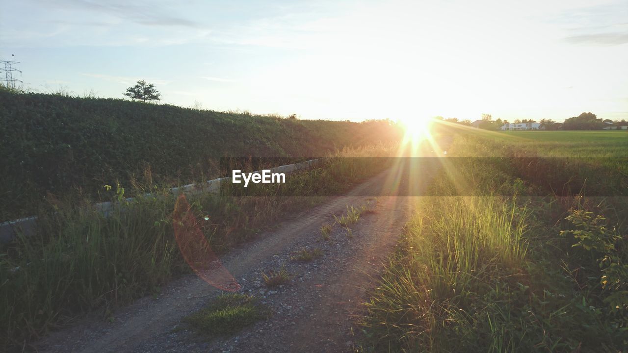 SCENIC VIEW OF LANDSCAPE AGAINST SKY DURING SUNSET