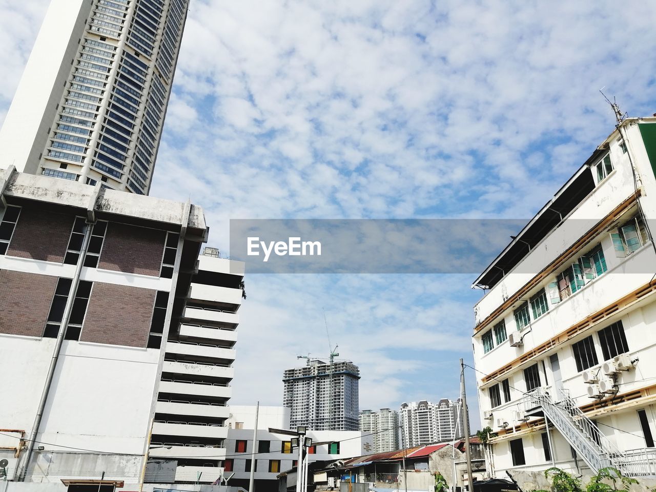 LOW ANGLE VIEW OF RESIDENTIAL BUILDINGS AGAINST SKY