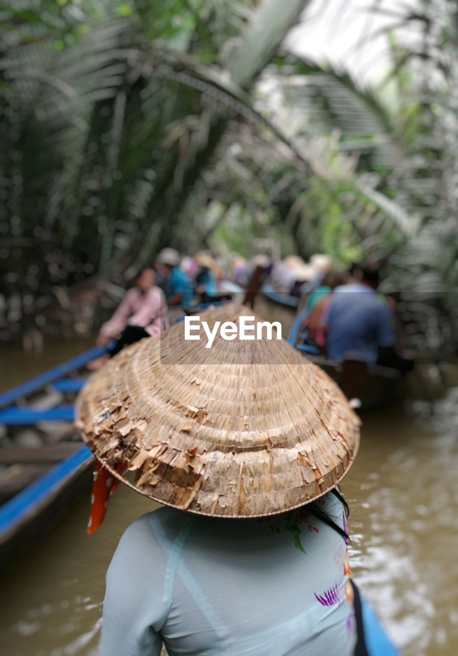 Rear view of woman on boat