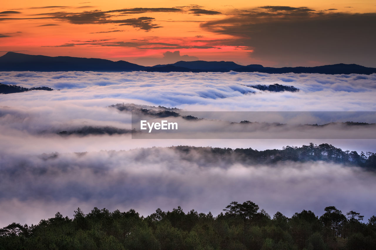 Scenic view of mountains against sky at night