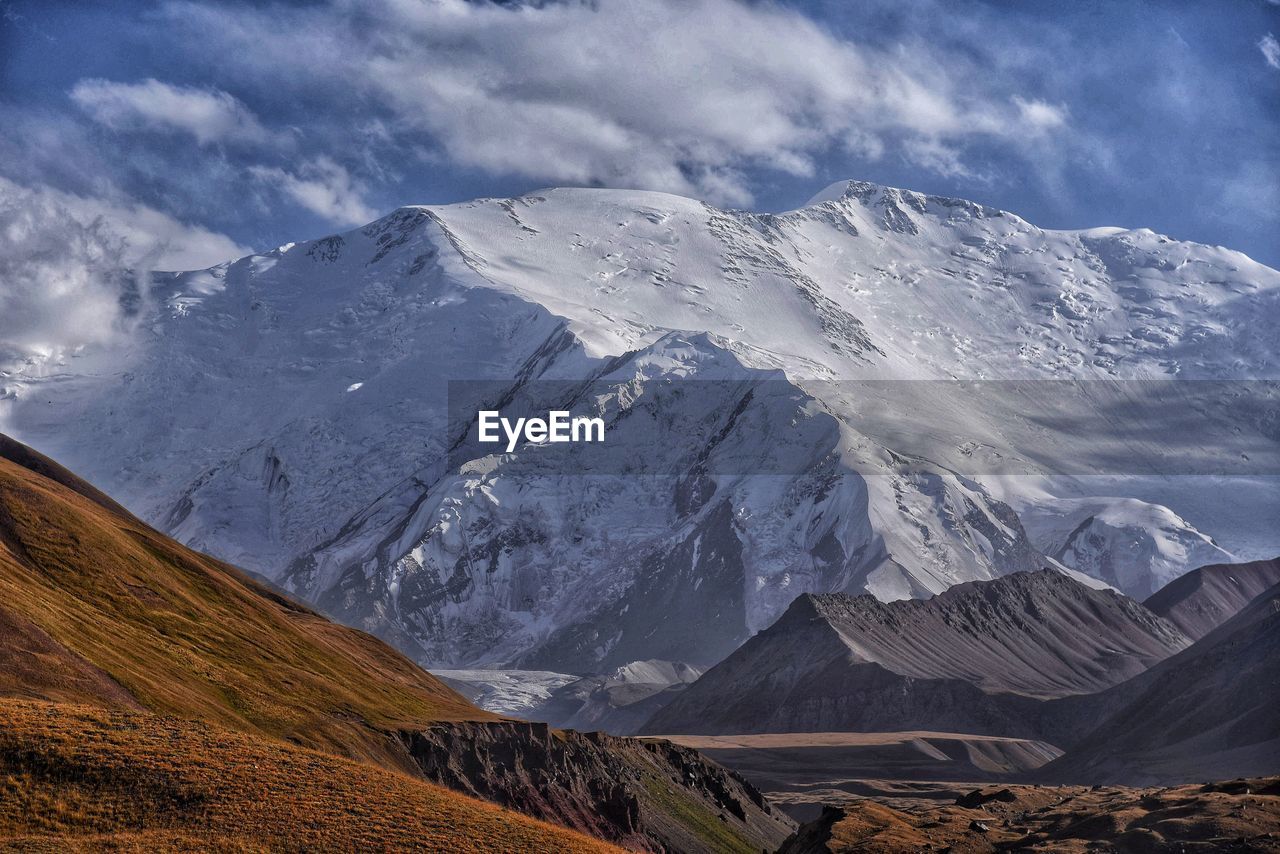 Scenic view of snowcapped mountains against sky