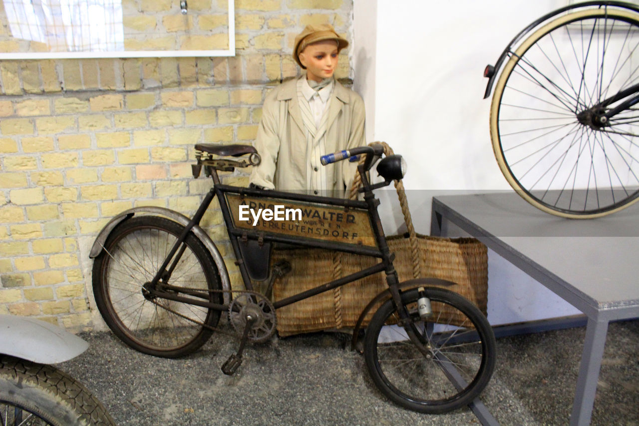 SIDE VIEW OF A BOY WITH BICYCLE
