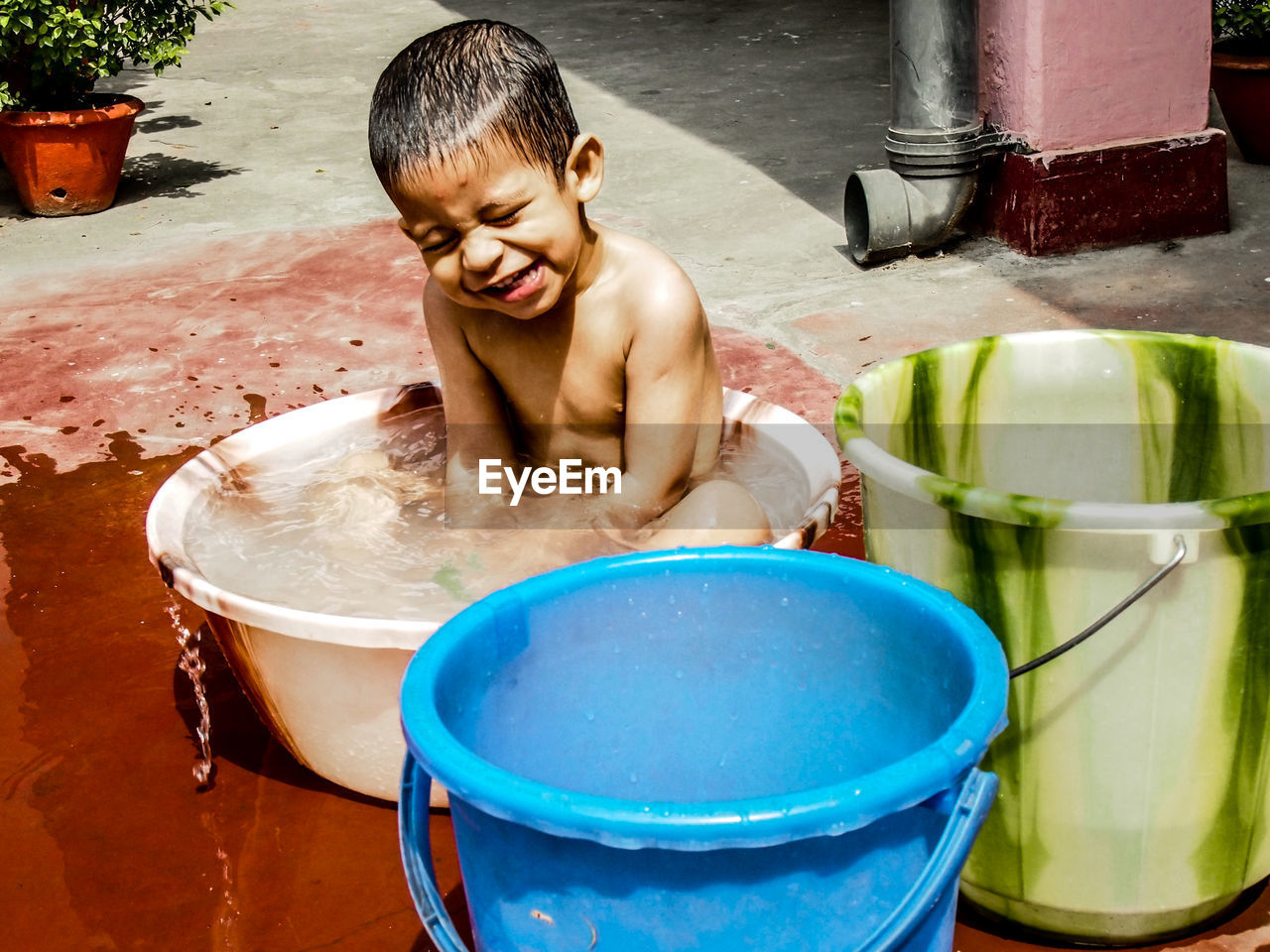 Boy sitting in tub