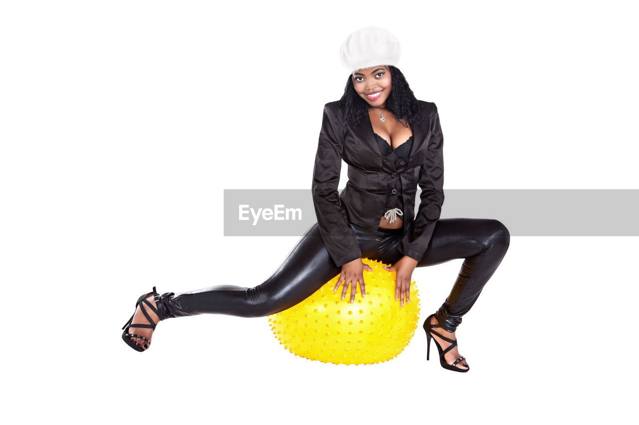 one person, full length, studio shot, adult, women, portrait, white background, clothing, cut out, young adult, indoors, footwear, looking at camera, sports, female, hat, motion, lifestyles, happiness, fashion, vitality, jumping, black, copy space, emotion, fun, smiling, person