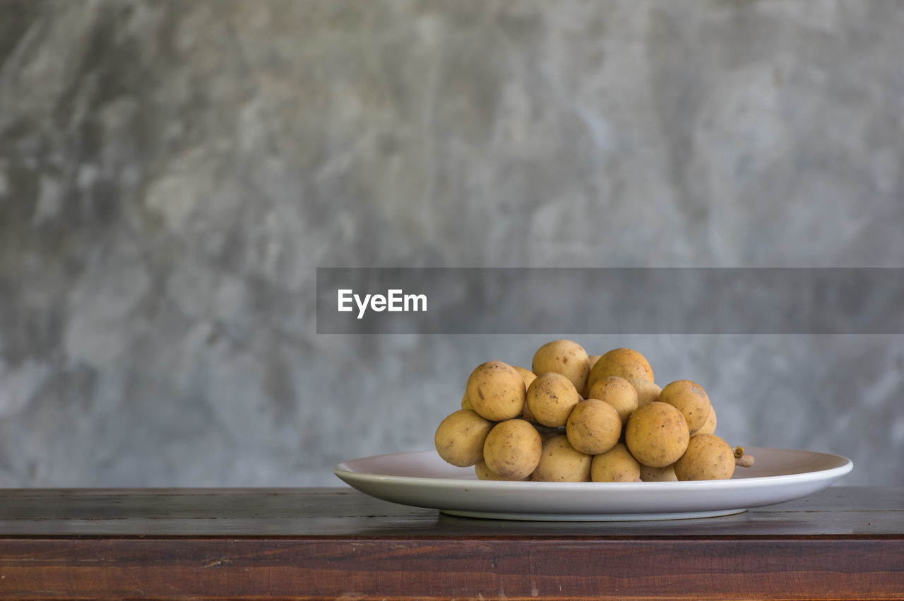 Close-up of fruits in bowl on table