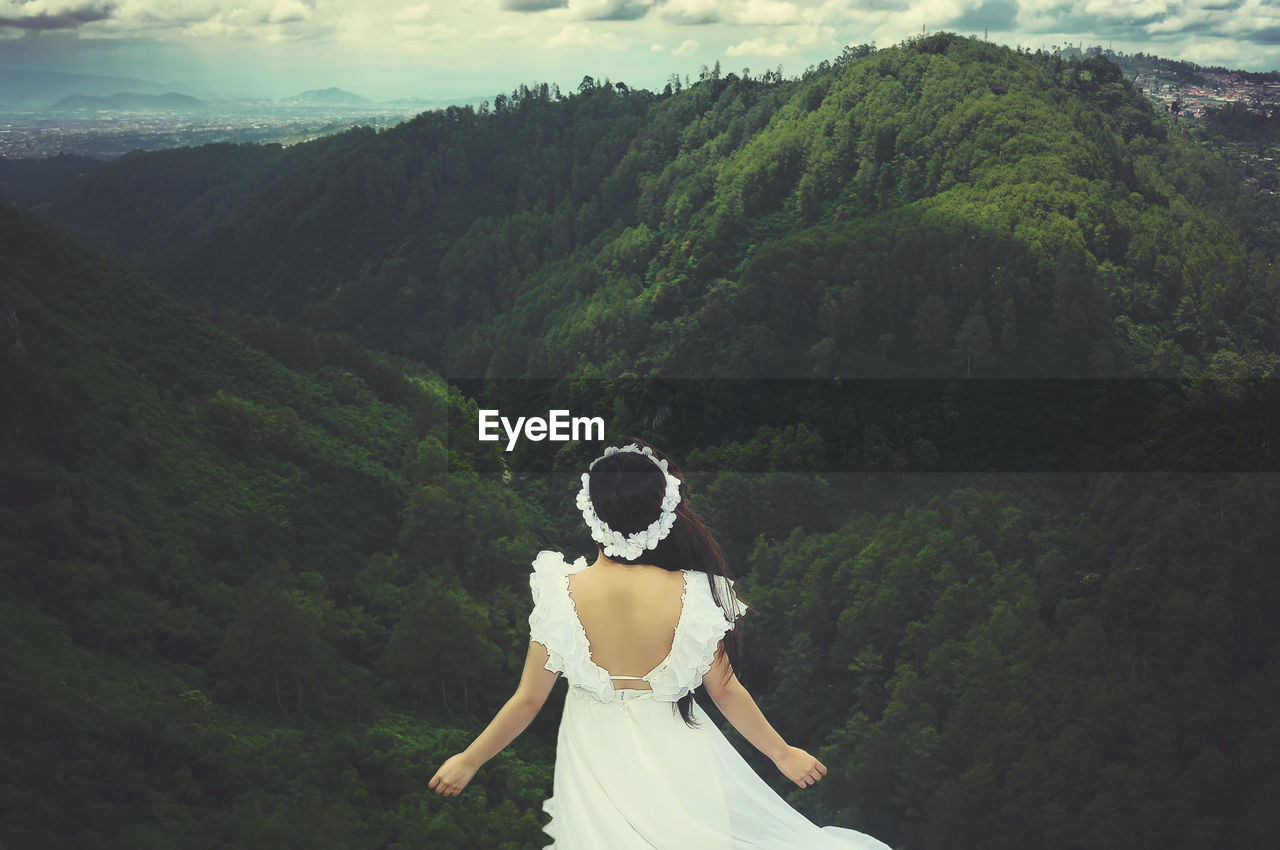 Woman standing on mountain