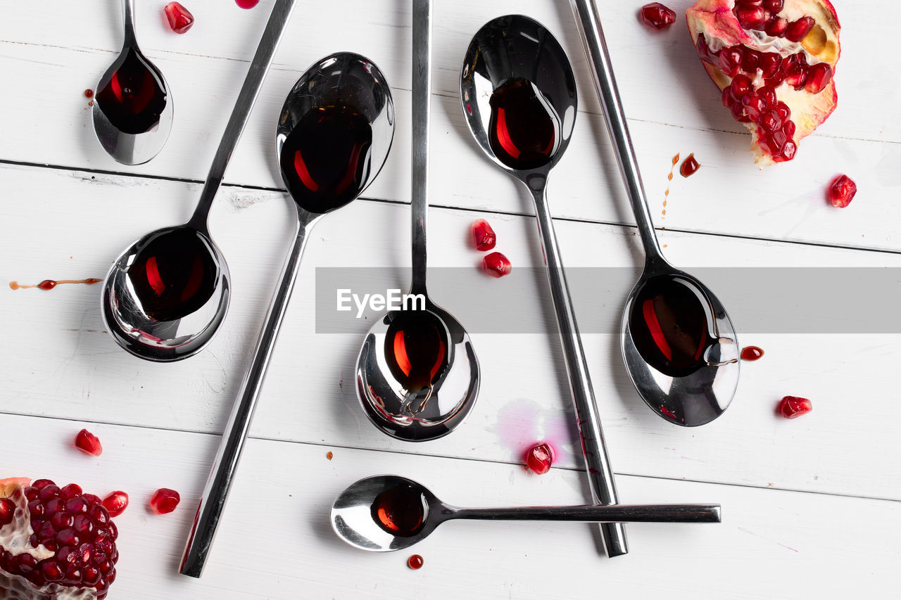 HIGH ANGLE VIEW OF RED WINE GLASSES ON TABLE