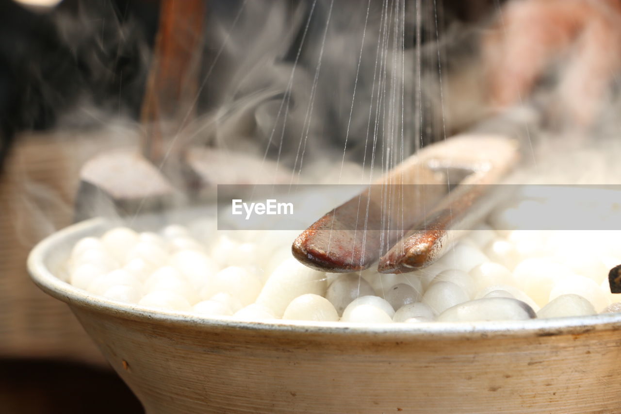 Close-up of silk reeling in factory