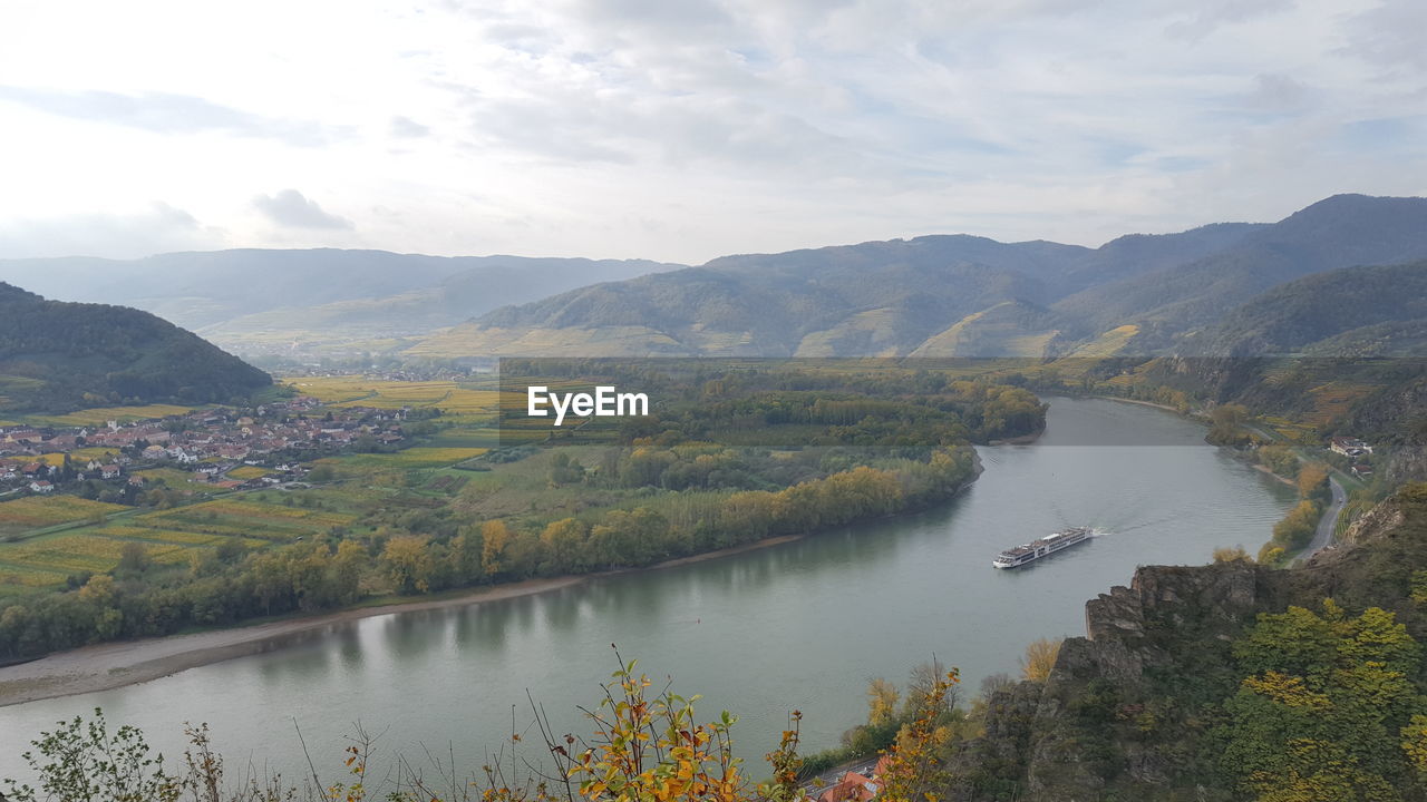 Scenic view of danube river and mountains against sky