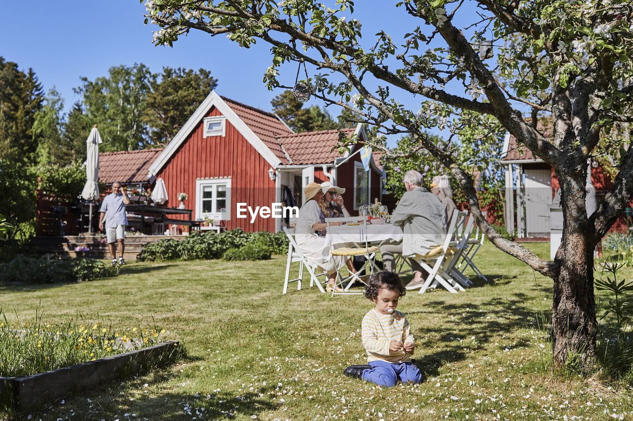 Toddler playing in garden