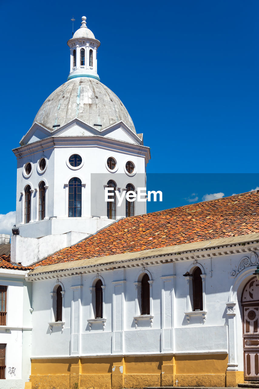 Exterior of san sebastian church against clear blue sky in city