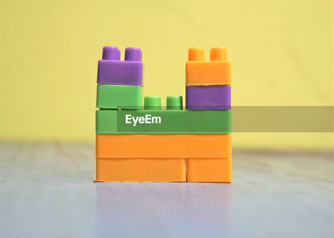 CLOSE-UP OF TOYS ON TABLE