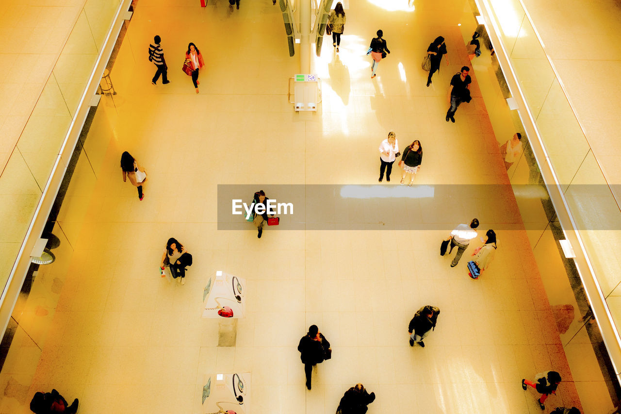 High angle view of people in shopping mall at station